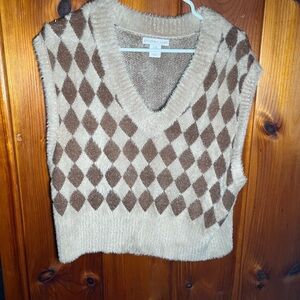 This brown soft vest has never been worn, it’s a medium from sincerely Jules